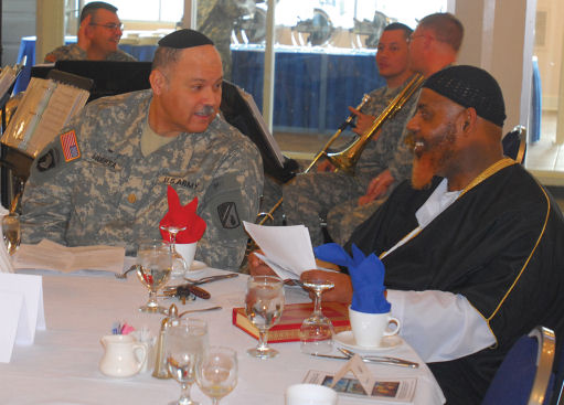 Jewish Chaplain (Maj) Carlos Huerta talks with Muslim imam Dawud Salahuddin Bin Pearson before the start of the National Prayer Breakfast. (US Army Photo)